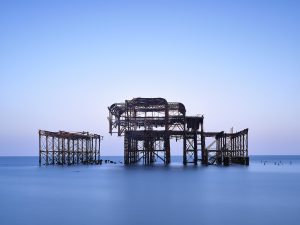 Remains of the West Pier, Brighton, East Sussex. Long exposure photograph showing the skeletal structure of the old pier